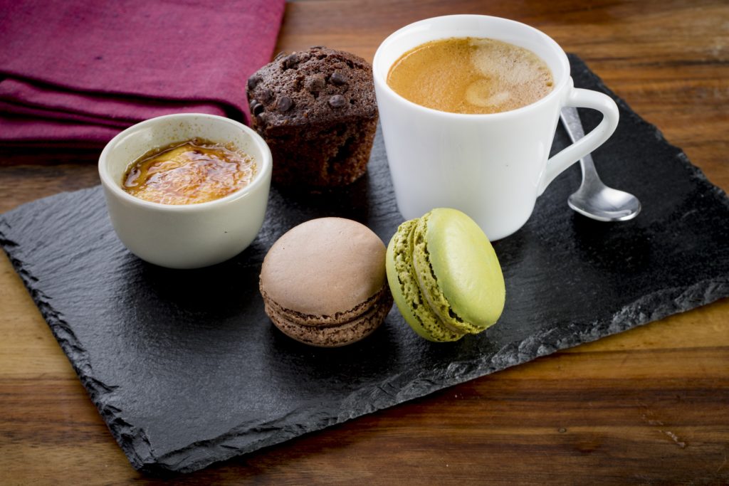 A café gourmand served in France. The dish is a coffee served with